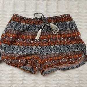 Patterned orange and black lounge shorts size 4